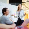 Women giving a presentation to colleagues